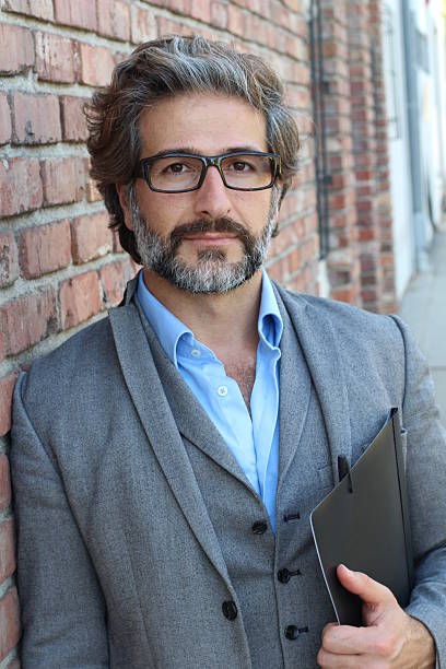 istock Business man outside modern creative office. 587216694