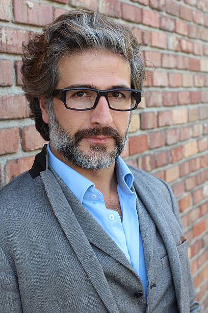 istock Businessman with glasses in classic suit 587217098