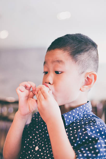 istock Asian child eat food 587218118