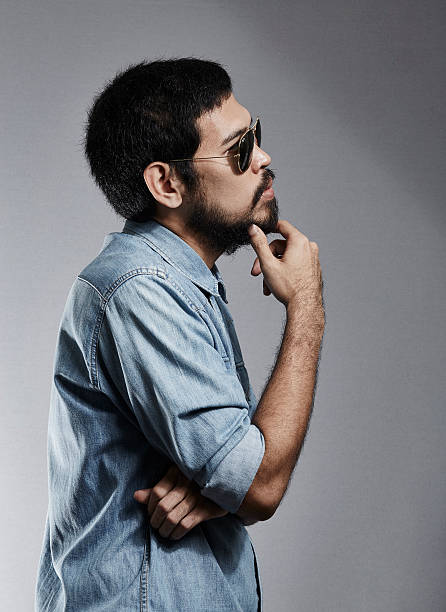 istock Asian Rocker handsome guy posing in stylish jeans clothes 587219490