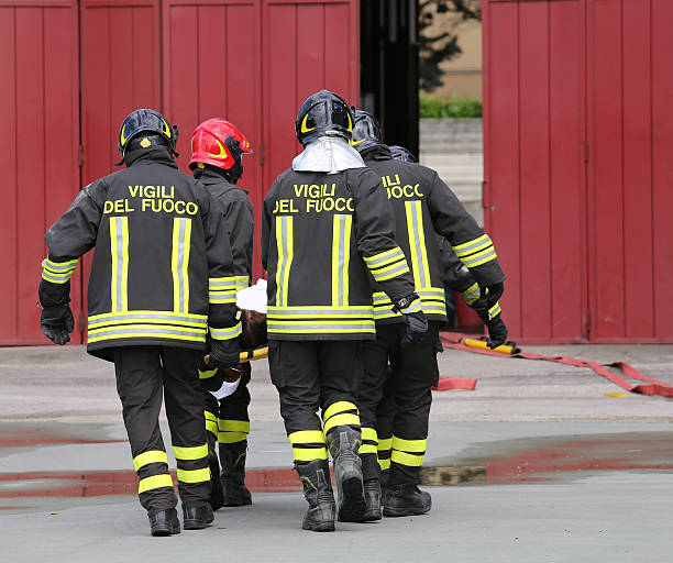 istock wounded carried by firefighters on a stretcher 587220644