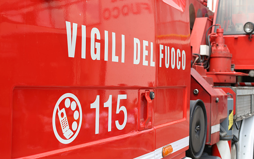 big words VIGILI DEL FUOCO meaning firefighters on the side of the Italian fire trucks and emergency phone number to call