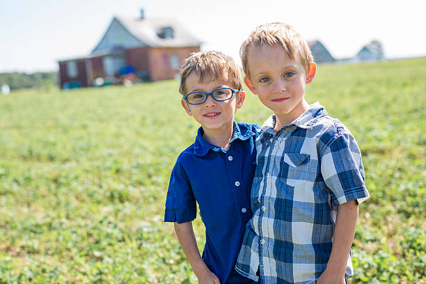 istock Two Children Together In field 587221626