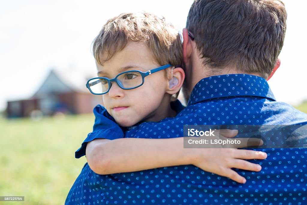Father And Son Hugging On Outdoor summer A Father And Son Hugging On Outdoor summer Child Stock Photo