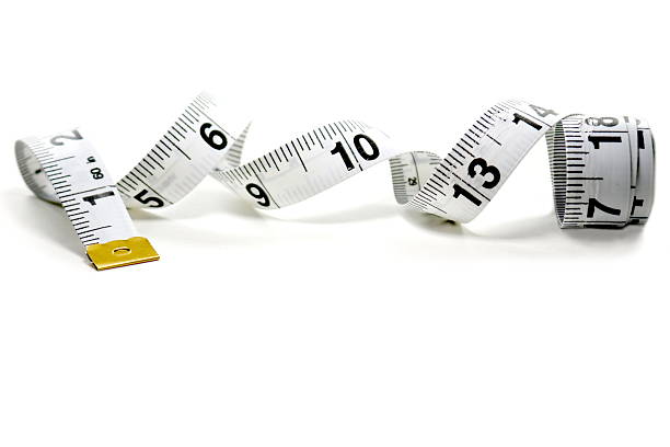 istock Unraveling Measuring Tape on White Backdrop 587223652