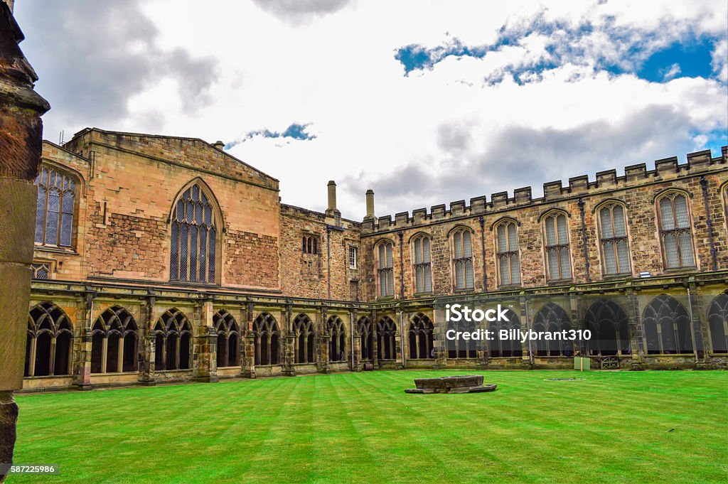 Durham Cathedral Yard and Sky, England Green yard and overcast sky at Durham Cathedral in England Durham Cathedral Stock Photo