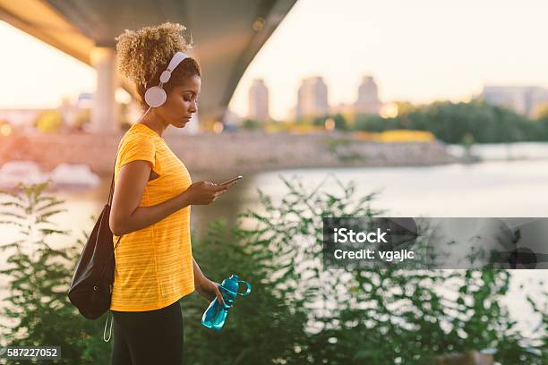 Latina Runner Stock Photo - Download Image Now - Walking, Headphones, Women