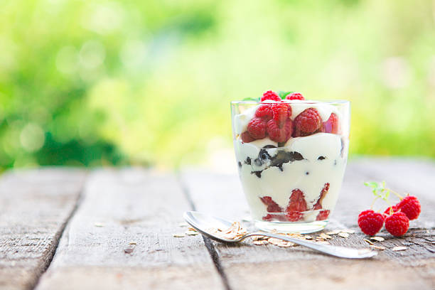 istock Natural yogurt with fresh raspberries, black currant and muesli. 587228914