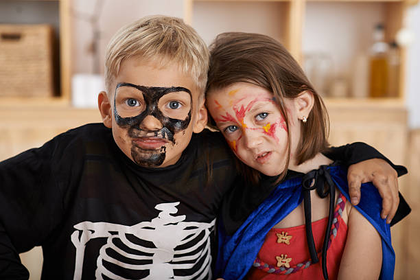 istock Kids in halloween costumes 587229364