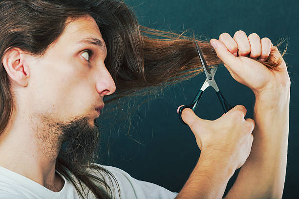 istock Barber cutting hair 587504706
