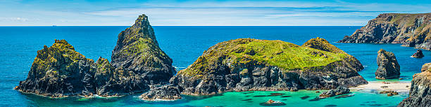 istock Cornwall idyllic summer ocean beach bay panorama Kynance Cove UK 587504764