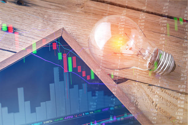 istock stock market chart with light bulb and free copy space 587505624