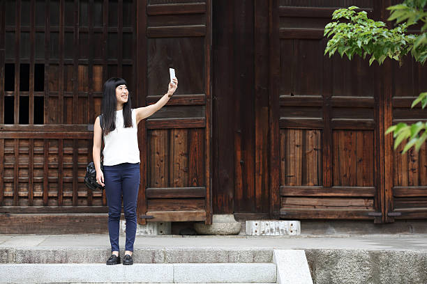 istock Japanese woman Selfie 587507406