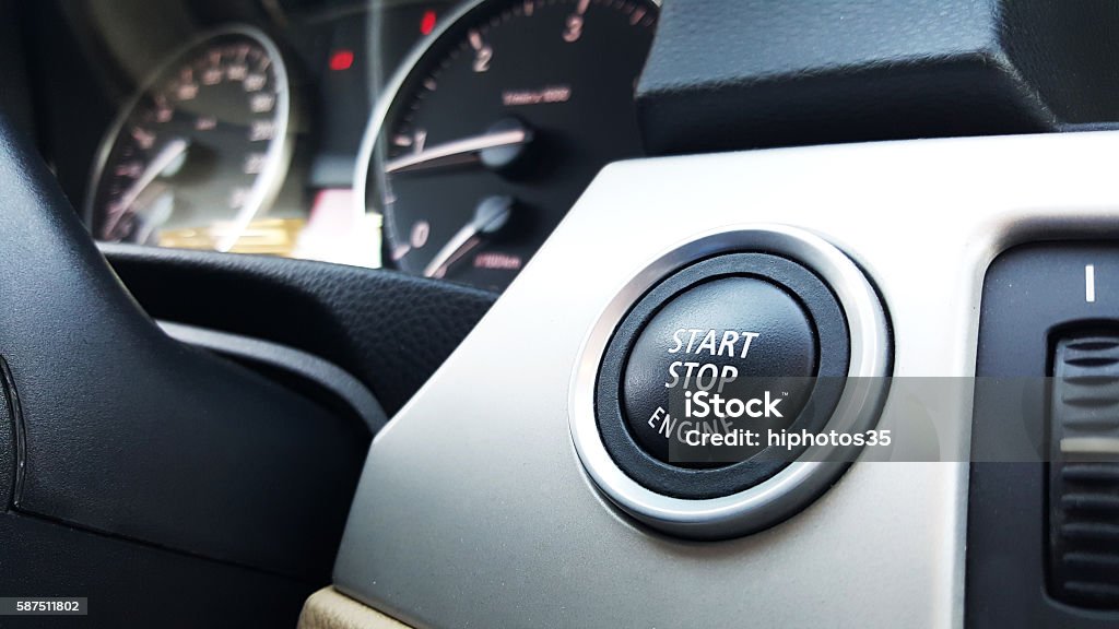 Close-up of an automatic start and stop car engine button Push the button to start the engine Start Button Stock Photo