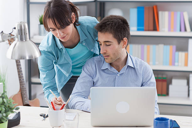 istock Young couple at home making plans 587515196