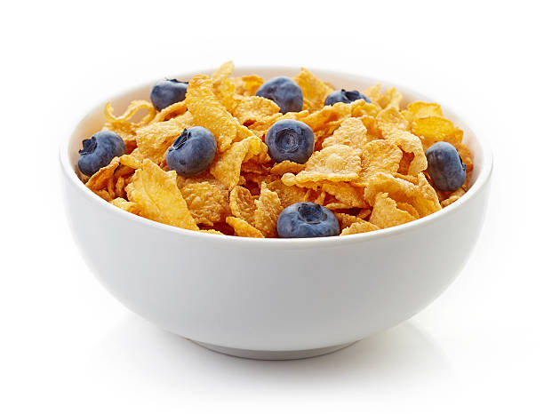 istock Bowl of corn flakes and blueberries isolated on white 587517292