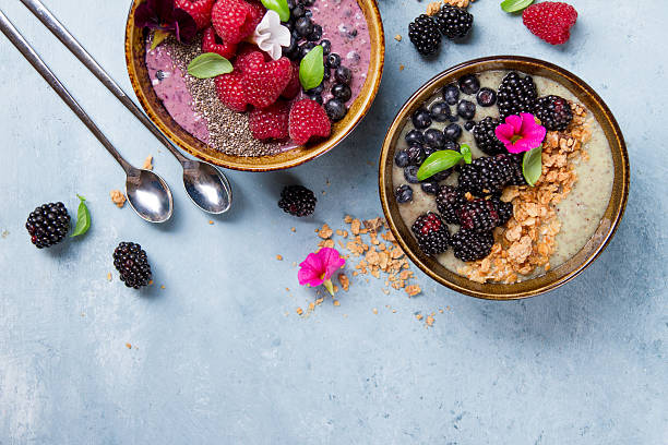 istock Breakfast berry smoothie bowl topped with berries 587519034