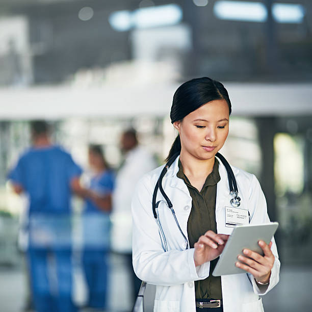 Her connection to patients, doctors and online medical resources stock photo
