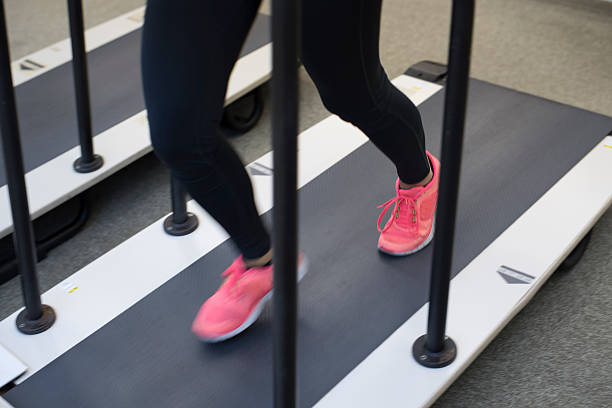istock Young woman running on machines. 587520250