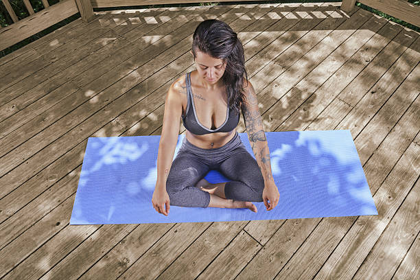 istock young female patio yoga 587520764