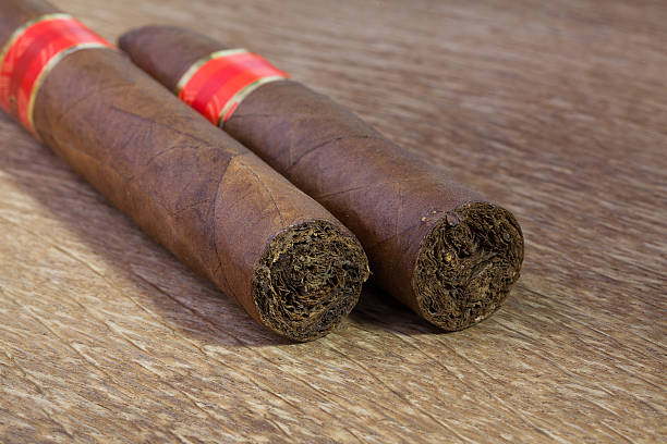 istock Different cigars on the old wooden table 587524876