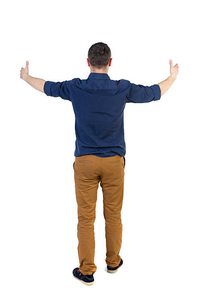 istock Back view of  business man shows thumbs up 587524932