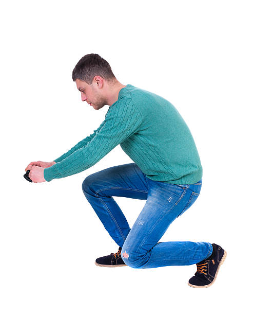 istock Back view of man photographing. 587525814