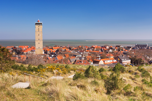 West-Terschelling village with the Brandaris lighthouse on the island of Terschelling in The Netherlands on a bright and sunny day.