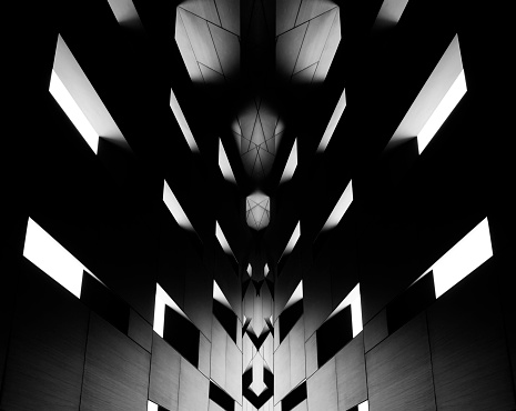 Reworked grayscale photo of modern architecture fragment in twilight featuring hi-tech and neo-Gothic motifs