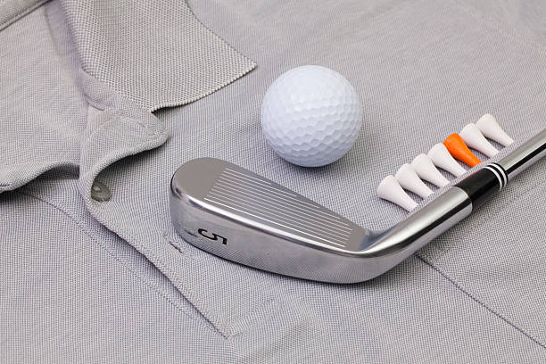 Grey polo shirt and golf equipments