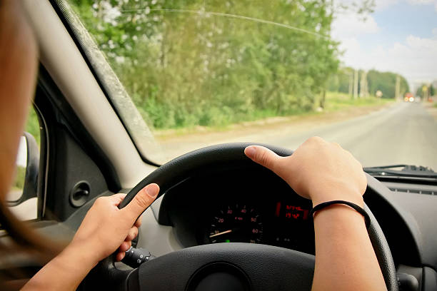 istock Woman driving a car 587529346