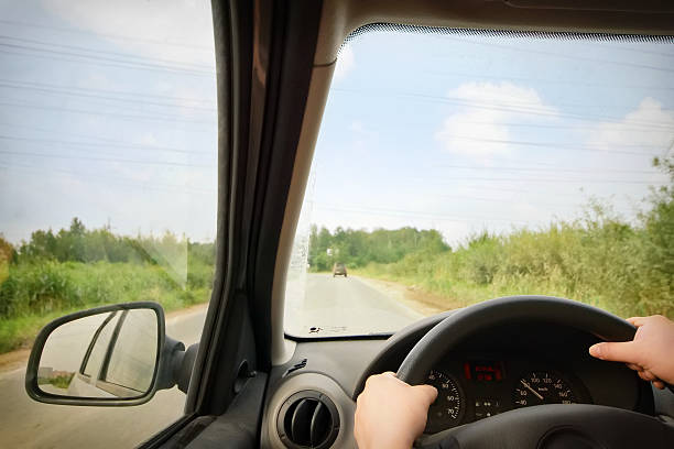 istock Woman driving a car 587529388