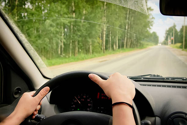 istock Woman driving a car 587529632