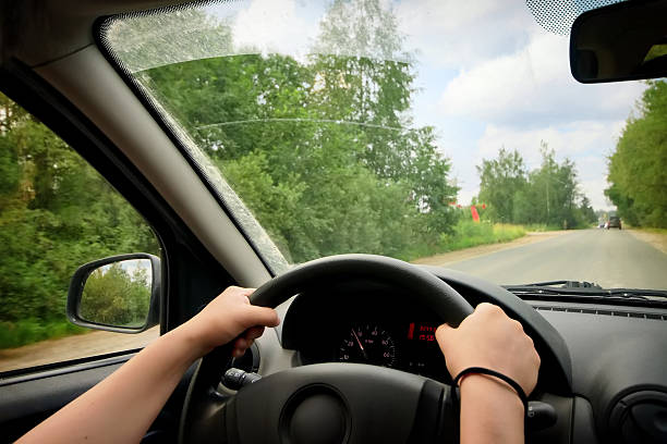 istock Woman driving a car 587529720