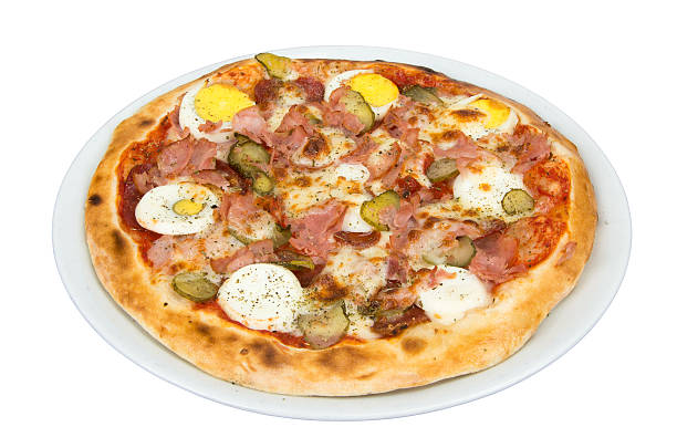 istock Pizza with eggs, ham, salami, cheese, pickles and spices. 587531492