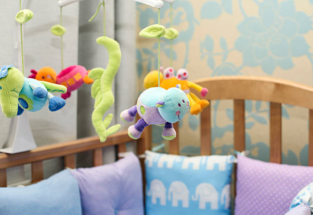 istock baby bed with toys 587533220