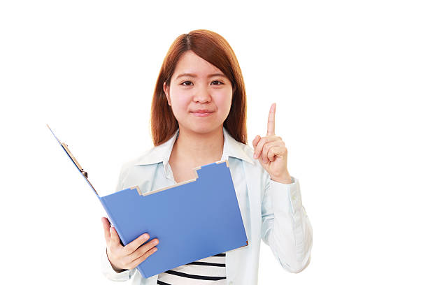 istock Asian woman pointing 587534138