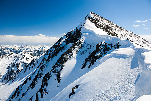 Mountain peak with snowcaps in winter. stock photo