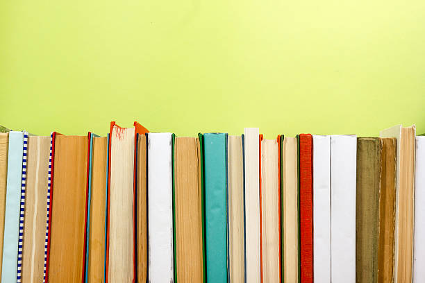 istock Colorful composition with vintage old hardback books stacking, diary on 587535542