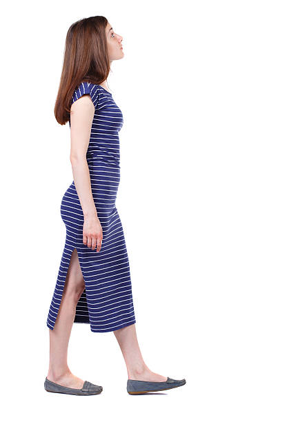 istock back view of walking  woman. 587535672