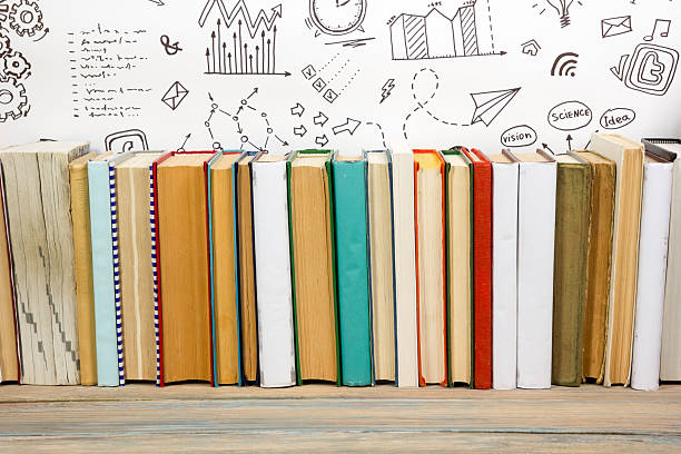 books on grunge wooden table desk shelf in library. back - success practicing book stack imagens e fotografias de stock