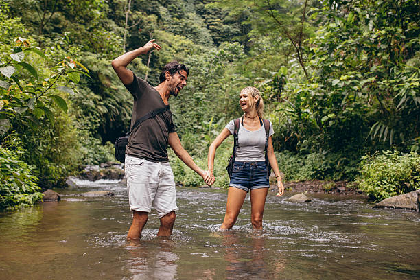 istock Couple having fun together outdoors on a hike 587537164
