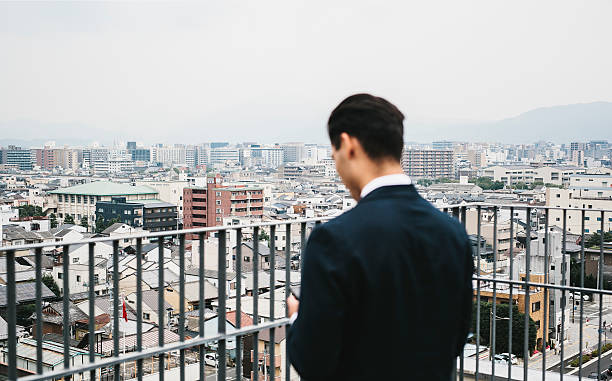 istock Architectual Landscape with a Businessman 587537220