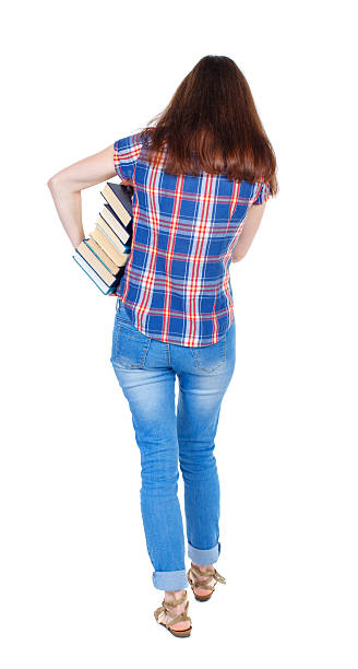 istock Girl comes with  stack of books. 587538292