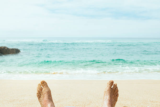 istock man's sand covered feet at the Beach, Pedn Vounder Cornwall 587538376