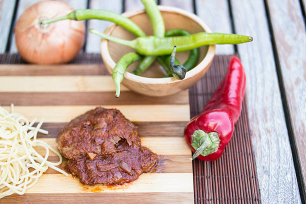 steak with tomato sauce, sphagetti and vegetables. - salisbury steak imagens e fotografias de stock