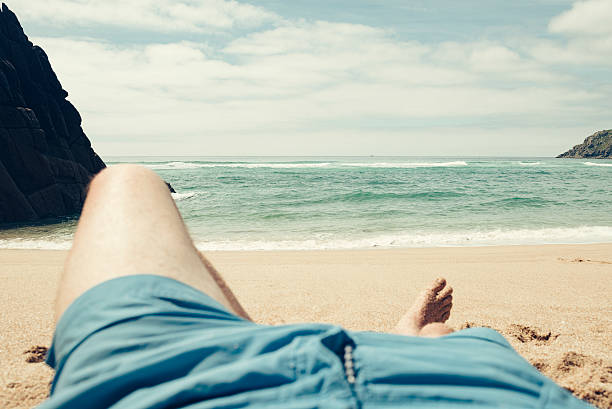istock POV Vacation, sunbathing Pedn Vounder Beach, Cornwall 587539374
