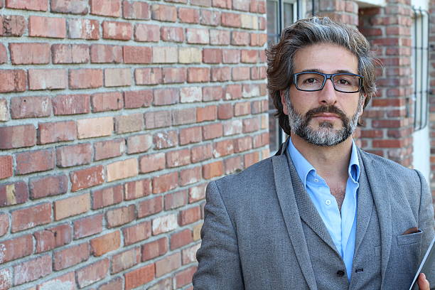 istock Businessman with glasses in classic suit 587539390