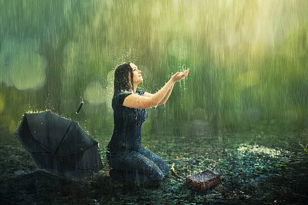 istock Woman and rain shower 587539650