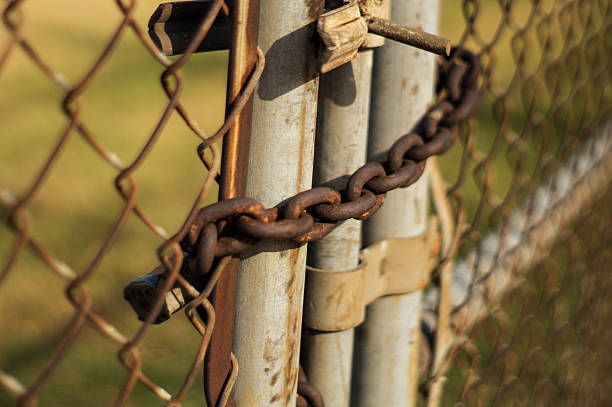 istock rusted metal chain close up fence 587540016